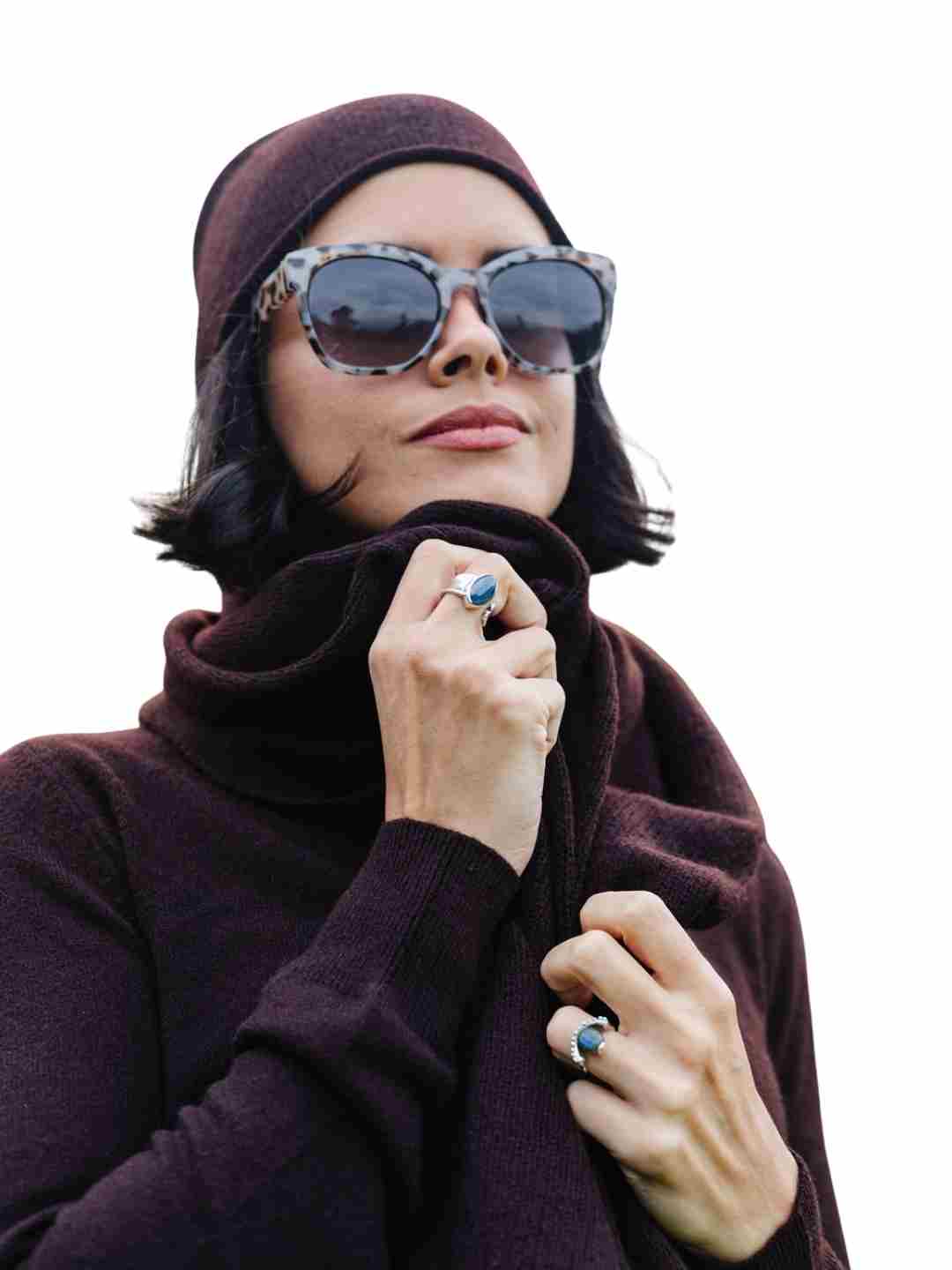 A women wearing a chocolate jumper and scarf and hat in sustainable organic cashmere