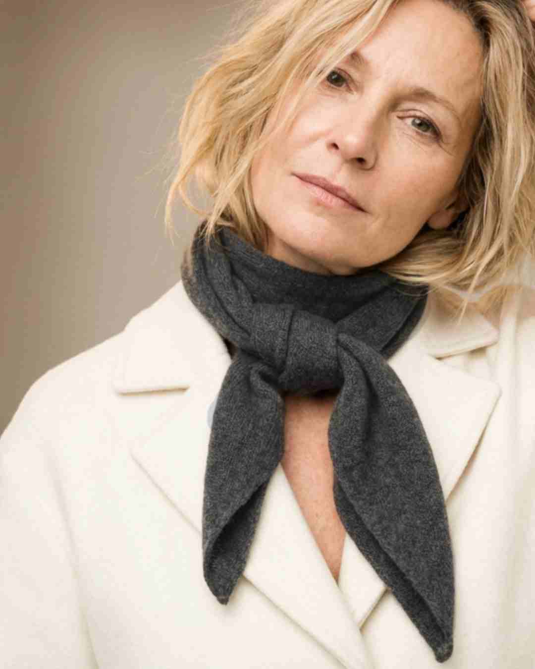 Irish woman wearing our grey cashmere bandana style triangle scarf