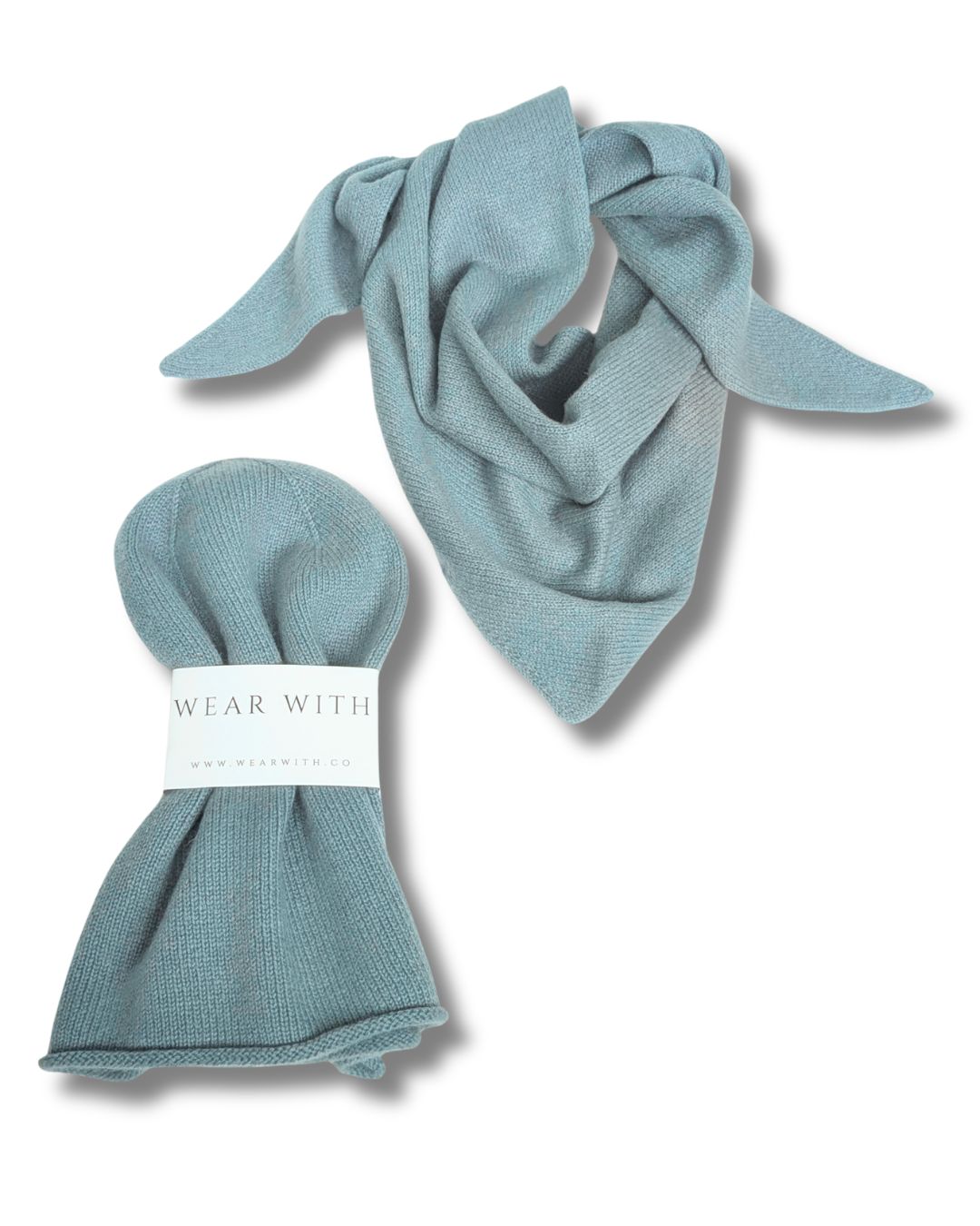 A sage green knit scarf, shown both draped and folded from WEAR WITH cashmere