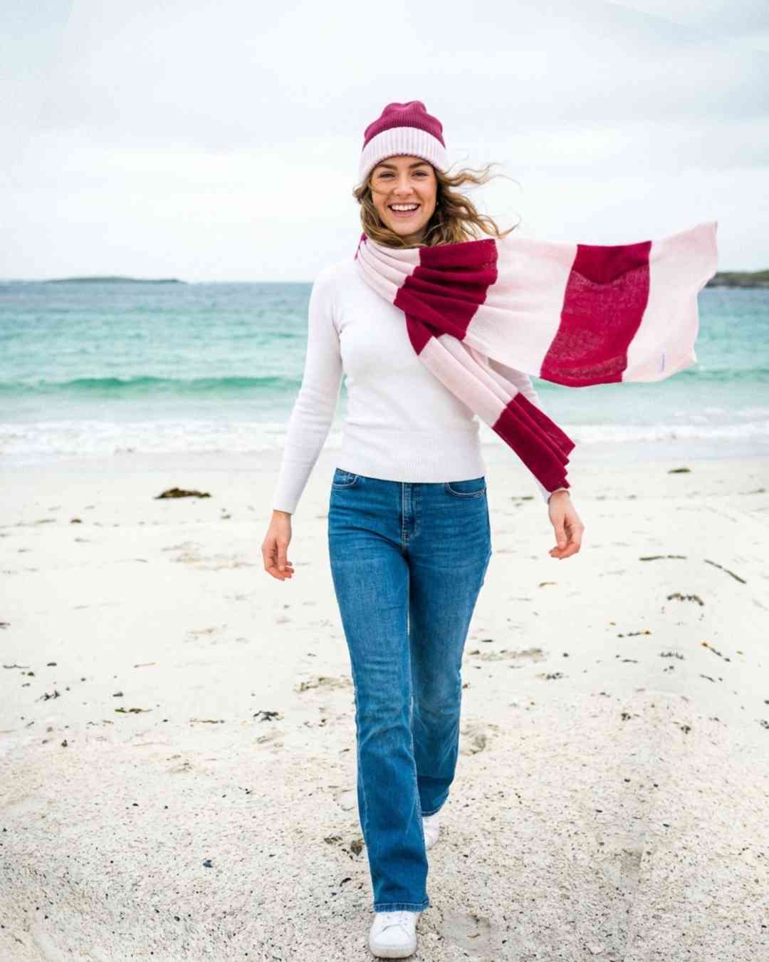 Irish woman on beach wearing wine ivory stripe cashmere featherlight scarf Wearwith
