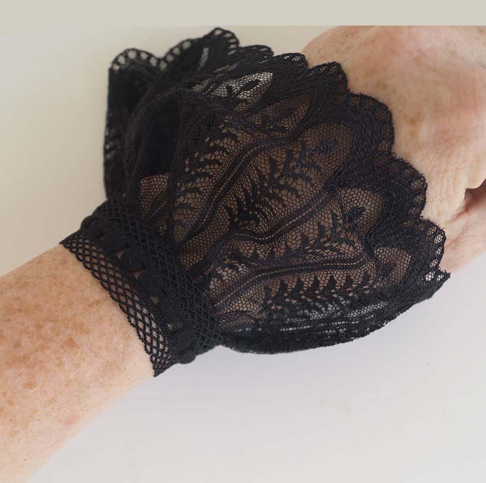 Close-up of delicate lace pattern on women’s detachable shirt cuffs – intricate craftsmanship and lightweight desig