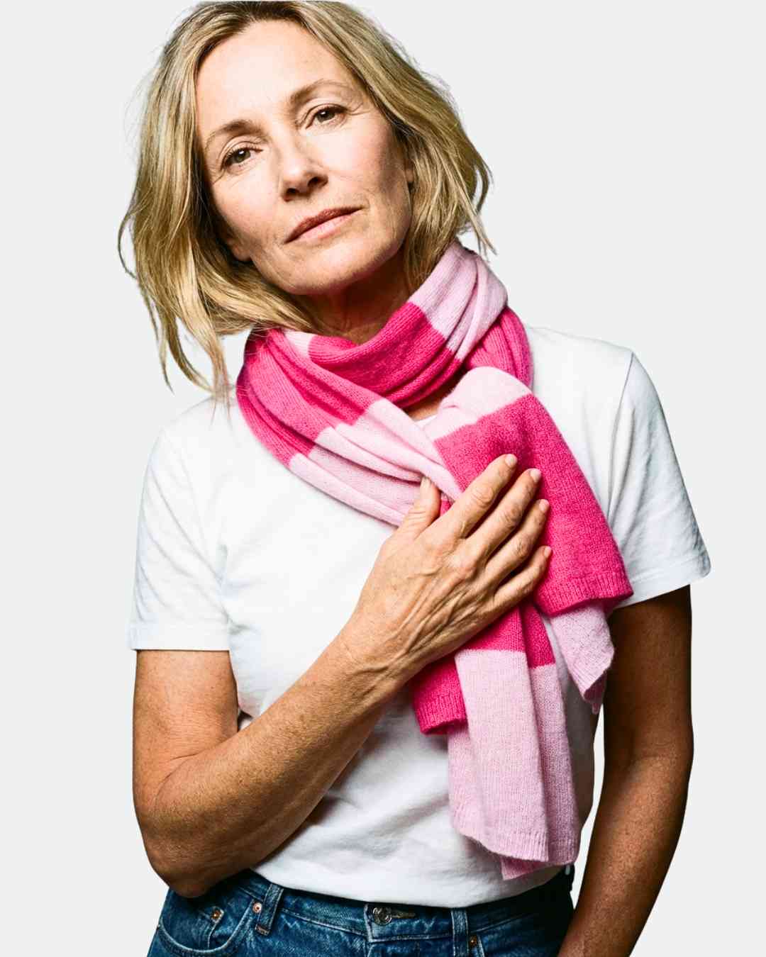 Woman wearing peony pink ribbed cashmere beanie hat with fuchsia turn-up by Wearwith Ireland