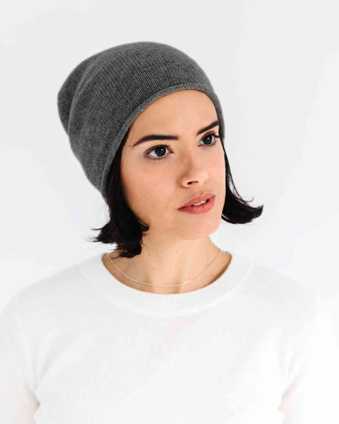 irish woman wearing a soft, grey  100% cashmere slouchy beanie hat from the Winter 2026 collection