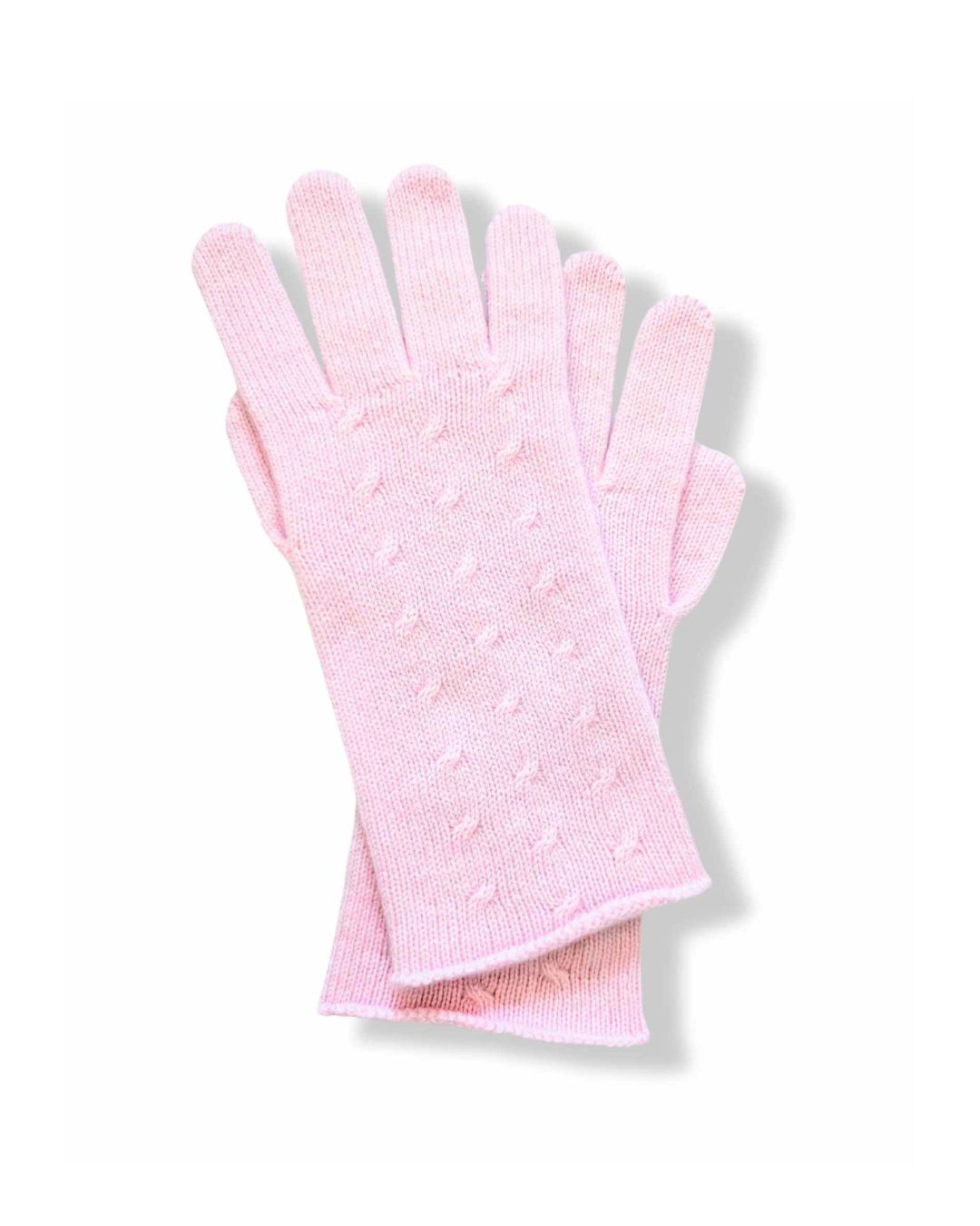 A pair of womens light pink cashmere knit gloves with a textured dotted pattern