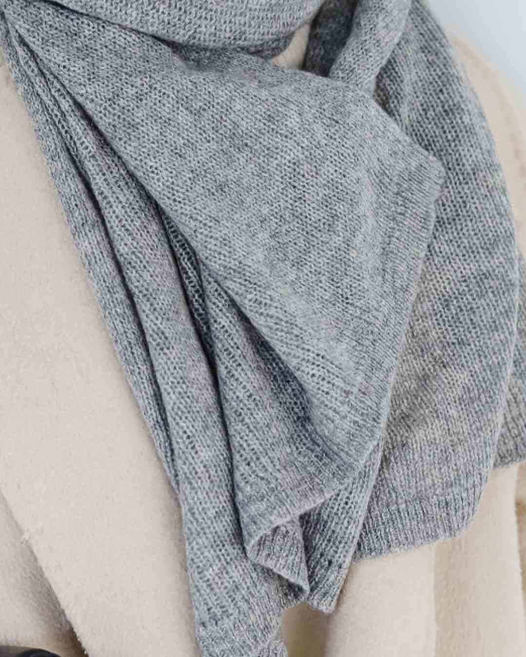 Premium cashmere travel wrap in neutral tones, a perfect accessory for flights and cold destinations